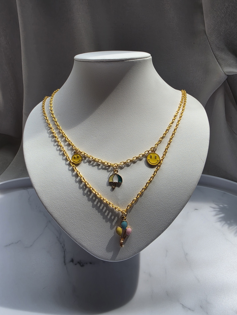 Gold-Tone Layered Necklace with Yellow Smiley & Multicolor Charms - Picture 2 of 5